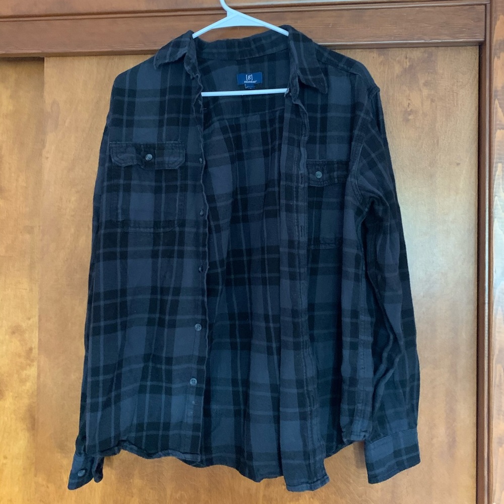Plaid button down shirt.